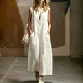 Elegant white sleeveless maxi dress with pockets for women's summer street style. - S / Dresses / White