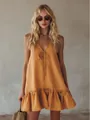 Model wearing a vintage V-neck sleeveless yellow ruffled mini dress for vacation style - S / Dresses / Turmeric