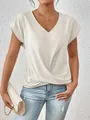 Close-up of elegant V-neck T-shirt with stylish twisted hem detail and silky fabric. - S / Tops / White
