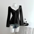 Haut décontracté noir élégant pour femme avec col en V, manches longues et nœud torsadé - XS / Hauts / Noir
