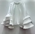 Elegant white satin blouse featuring dramatic and stylish multi-layered ruffle bell sleeves. - S / Tops / White