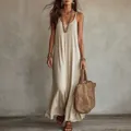 Κοντινό πλάνο ενός χαλαρού Bohemian μάξι φορέματος με άνετη εφαρμογή για διακοπές. - S / Dresses / Ζαχαρί