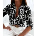 Elegante camicia nera a maniche lunghe da donna con stampa astratta di lettere bianche. - 3XL / Top / Nero Lettera
