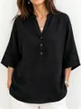 Detail of women's black loose linen blouse with V-neck and stand collar. - S / Tops / Black