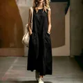 Minimalist black sleeveless maxi dress with pockets for a sophisticated summer look. - S / Dresses / Black
