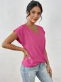 Detail view of the elegant V-neckline and vibrant pink fabric of this short-sleeved top - Rose Red