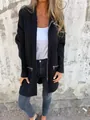 Detail view of a casual black zip-up cardigan with decorative silver pocket zippers. - S / Tops / Black
