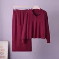 Detailed view of elegant burgundy knit set with polo neck sweater and matching skirt - One Size / Top And Bottom / Burgundy
