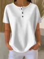 Vista dettagliata del top in maglia a nido d'ape bianco da donna con scollo henley. - Taglia S / Top / Bianco
