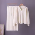 Detail of cream knit polo sweater and matching long skirt set for elegant autumn style - One Size / Top And Bottom / Apricot