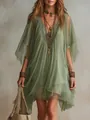 Close-up of a bohemian green V-neck chiffon dress with delicate lace detailing and textures. - S / Dresses / Green