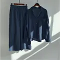Detail view of women's vintage cotton linen shirt and wide-leg trousers set - Navy Blue