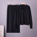 Sophisticated black knitted two-piece set featuring a polo collar sweater and midi skirt - One Size / Top And Bottom / Black