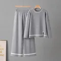 Macro detail of grey knitted two-piece set with contrast stripes and side slit - One Size / Top And Bottom / Gray