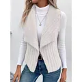 Elegant women's cream sleeveless vest featuring sherpa lapels and ribbed knit texture - S / Tops / White