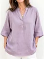 Detailed view of women's lilac V-neck linen blouse featuring wooden buttons and 3/4 sleeves - S / Tops / Light Purple