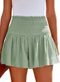 Close-up detail of sage green high-waisted cotton linen shorts with smocked waistband - S / Bottoms / Green
