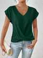Detail view of a dark green V-neck short sleeve T-shirt with an elegant twist hem design. - Dark Green