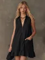 Sleeveless black A-line dress with V-neck half-zipper and ruffled hem detailing. - S / Dresses / Black