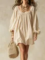 Vue détaillée d'une mini robe bohème ample à manches lanterne avec tissu texturé de qualité - S / Abricot