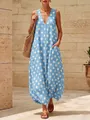 Visione dettagliata di un abito blu a pois con scollo a V, tasche e orlo a palloncino - Taglia S / Vestiti / Celeste