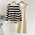 Close-up of striped knit texture on the sweater and coordinating cream midi skirt - One Size / Top And Bottom (6699) / Apricot