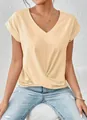 Close-up of elegant v-neck t-shirt featuring a unique twisted hem detail - S / Tops / Apricot