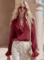 Detail view of a vintage French ruffle V-neck burgundy linen shirt on a model - Burgundy