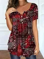 Detail view of red paisley print T-shirt with V-neck and decorative buttons. - 1XL / Tops / Burgundy