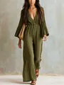 Detail view of a bohemian olive green V-neck long-sleeve wide-leg jumpsuit on a model - S / Jumpsuits / Army Green
