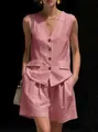 Detail view of a pink linen two-piece set featuring a sleeveless V-neck vest and shorts - S / Top And Bottom (2552) / Pink