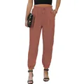 Detail shot of terracotta high-waisted drawstring joggers with elasticated cuffed ankles. - S / Bottoms / Brick Red