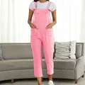 Full body view of women's casual pink cotton overalls over a white t-shirt - S / Jumpsuits / Pink