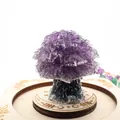Detailed view of a purple amethyst crushed stone crystal tree on a wooden base. - 5cm*4.2cm / Amethyst
