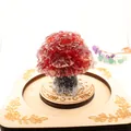 Detailed view of a red crystal fortune tree on an engraved wooden decorative base. - 5cm*4.2cm / Red Glass