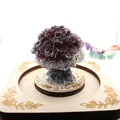 Detailed view of a natural garnet crystal crushed stone tree on a carved wooden base - 5cm*4.2cm / Garnet