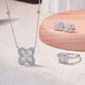 Detailed macro shot of the S925 silver moissanite clover necklace, ring and earrings set - US Size 5 / Set