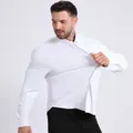 Professional high-stretch white dress shirt for men showing seamless fabric elasticity - Tops / White