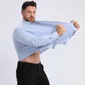 Professional light blue high elasticity men's dress shirt showing stretchable fabric - Tops / Light Blue