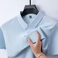 Light blue cooling ice silk men's polo shirt showing elastic fabric texture detail - Moonlight Blue