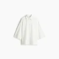 Elegante camicia bianca con frange e bottoni per donna, stile primaverile alla moda - XS / Top