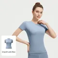 Top fitness yoga ad alta elasticità a maniche corte in variante blu lago grigio - Taglia S / Top E Pantaloni / Blu Grigiastro
