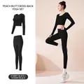 Set yoga nero due pezzi con top a maniche lunghe incrociato sulla schiena e leggings a vita alta - Taglia S / Top E Pantaloni / Nero Stellato + Nero Stellato