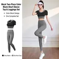 Schlankes zweiteiliges Yoga-Set mit schwarzem Fake-Zweiteiler-Top und grauer Leggings - Sternenschwarz + Meersalzgrau