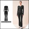 Elegantes schwarzes Yoga-Set mit V-Ausschnitt-Falten-Oberteil und Schlaghose - S / Oberteil Und Unterteil / Sternenschwarz + Sternenschwarz