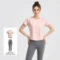 Women's activewear fitness set featuring light pink short sleeve t-shirt and sea rock grey leggings - Light Pink + Sea Rock Grey