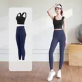 Two-piece yoga set featuring a black sports bra and navy blue high-waist leggings - Starry Black + Whale Blue