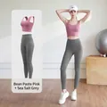 Two-piece yoga set featuring a pink sports bra and grey high-waisted leggings for fitness - Dusty Rose + Sea Rock Grey