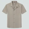 Stylish men's short-sleeved shirt featuring a relaxed Cuban collar in solid khaki beige - Bean Green