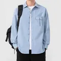 Men's light blue long-sleeve cotton shirt with chest pocket and button-down front - Blue